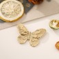 Broche papillon dorée