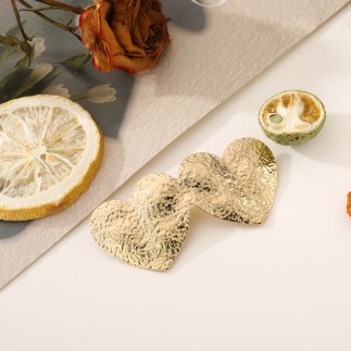 Broche double coeur dorée