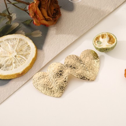 Broche double coeur dorée